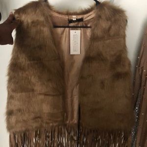 Brand new fur vest with fringes